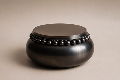 Beaded Pillow Plinth Base black marble plinth base by 1-OPH, three-quarter studio view