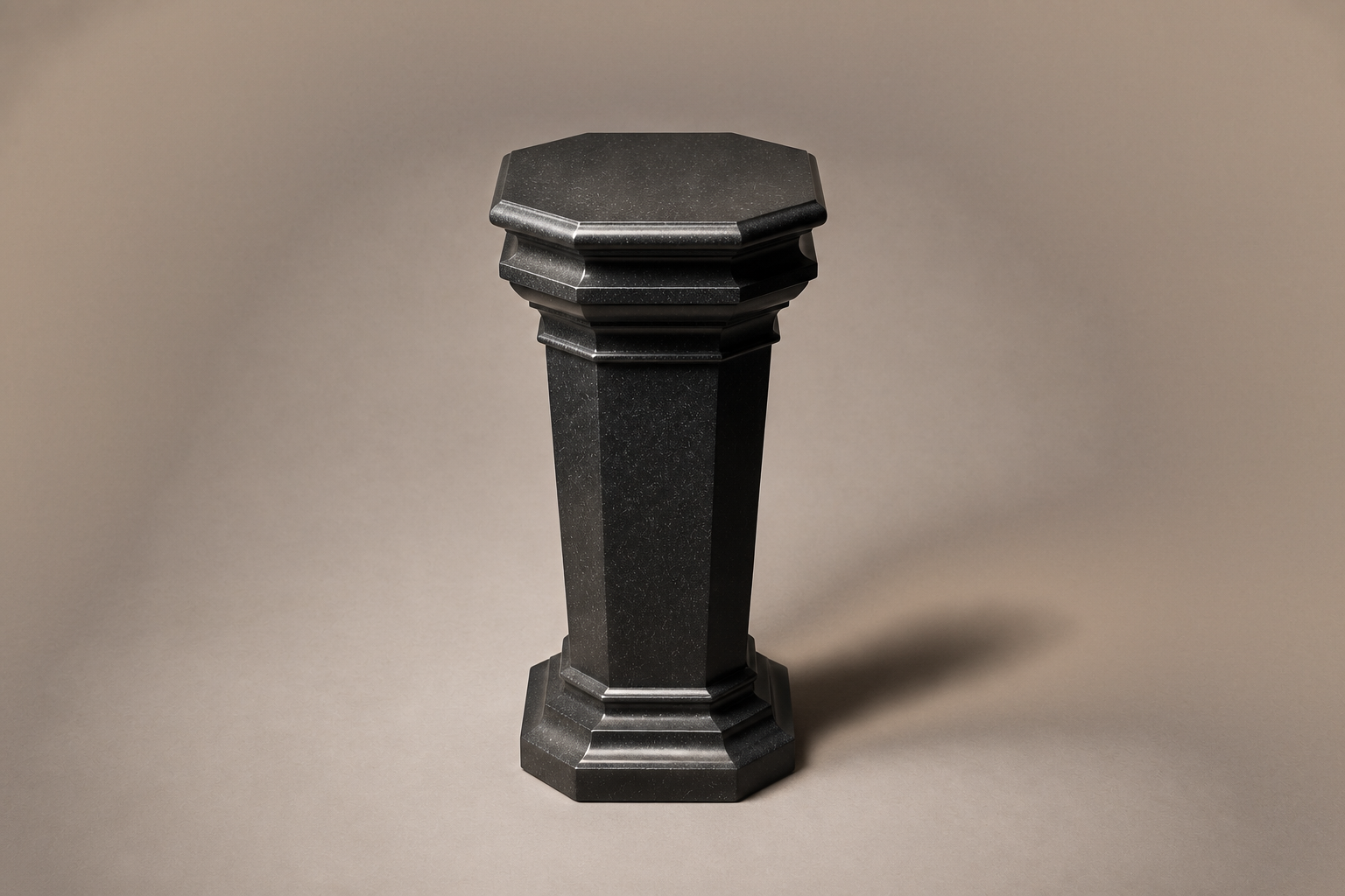 Tapered Pedestal Base Faceted black granite plinth base by 1-OPH, three-quarter studio view