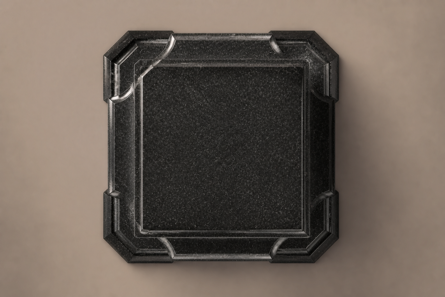 Tapered Pedestal Base Faceted black granite plinth base by 1-OPH, overhead view