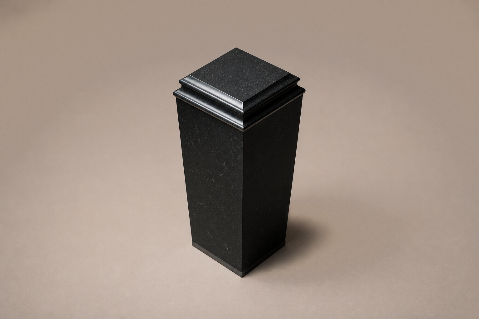 Tapered Pedestal Base Slim black granite plinth base by 1-OPH, three-quarter studio view