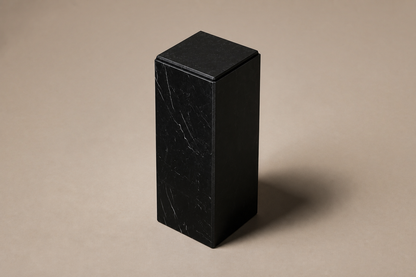Beveled Monolith Base Column black marble plinth base by 1-OPH, three-quarter studio view