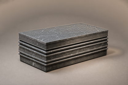 Grigio Ribbed Base Low grigio carnico marble plinth base by 1-OPH, three-quarter studio view