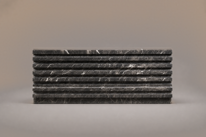 Grigio Ribbed Base Long grigio carnico marble plinth base by 1-OPH, side elevation