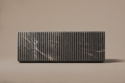 Pietra Grey Reeded Base Grey pietra grey marble plinth base by 1-OPH, side elevation