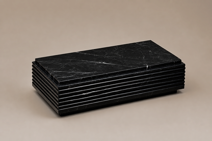 Ribbed Horizontal Base Long black marble plinth base by 1-OPH, three-quarter studio view