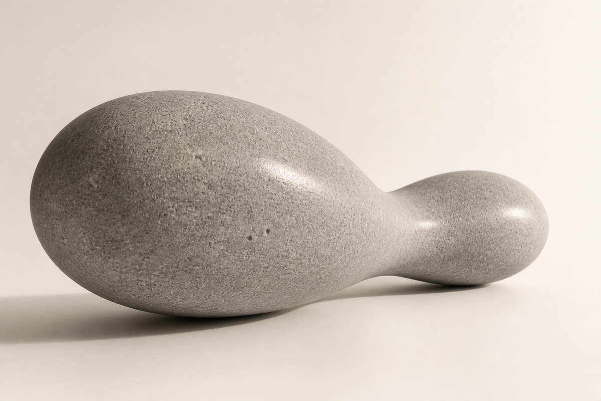 PEBBLE FLOW BENCH XIII, three-quarter studio view showing its profile