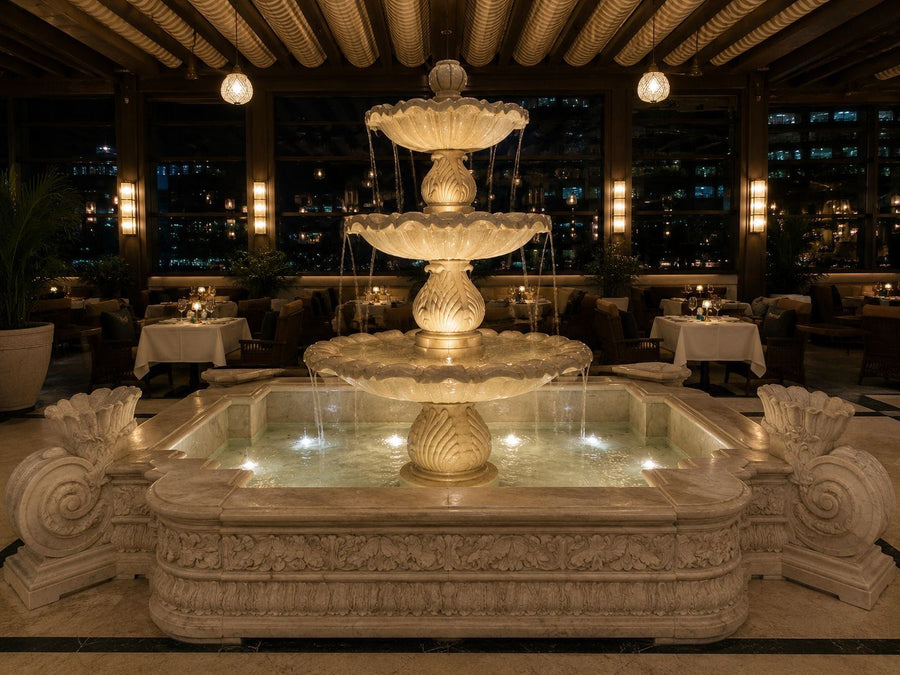 The Palm Fountain, a three-tier white marble fountain on the terrace of Signor Sassi, Palm Jumeirah