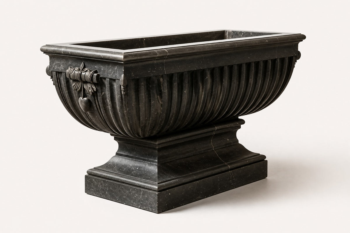 Pietra Grey Garland Marble Urn Planter — 85 cm Pietra Grey marble trough planter with fluted sides and a carved ribbon medallion, three-quarter studio view showing its profile