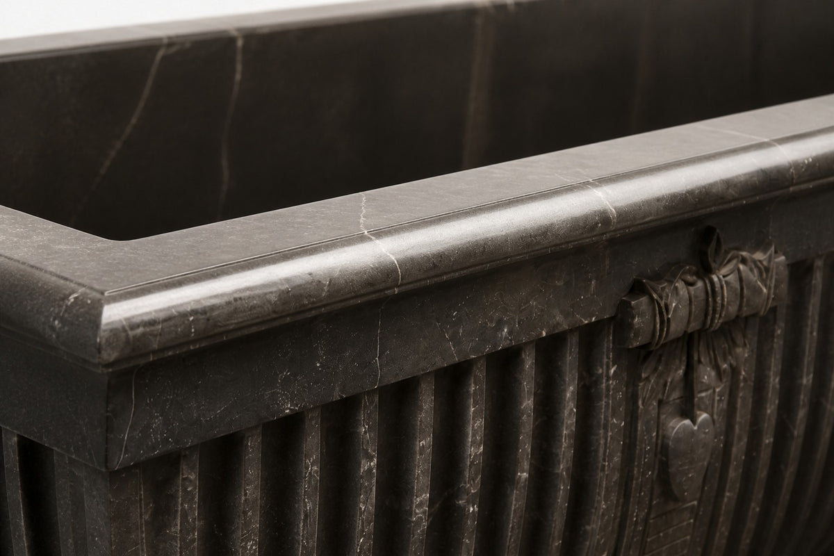 Pietra Grey Garland Marble Urn Planter — 85 cm Pietra Grey marble trough planter with fluted sides and a carved ribbon medallion, close studio detail of the surface and material