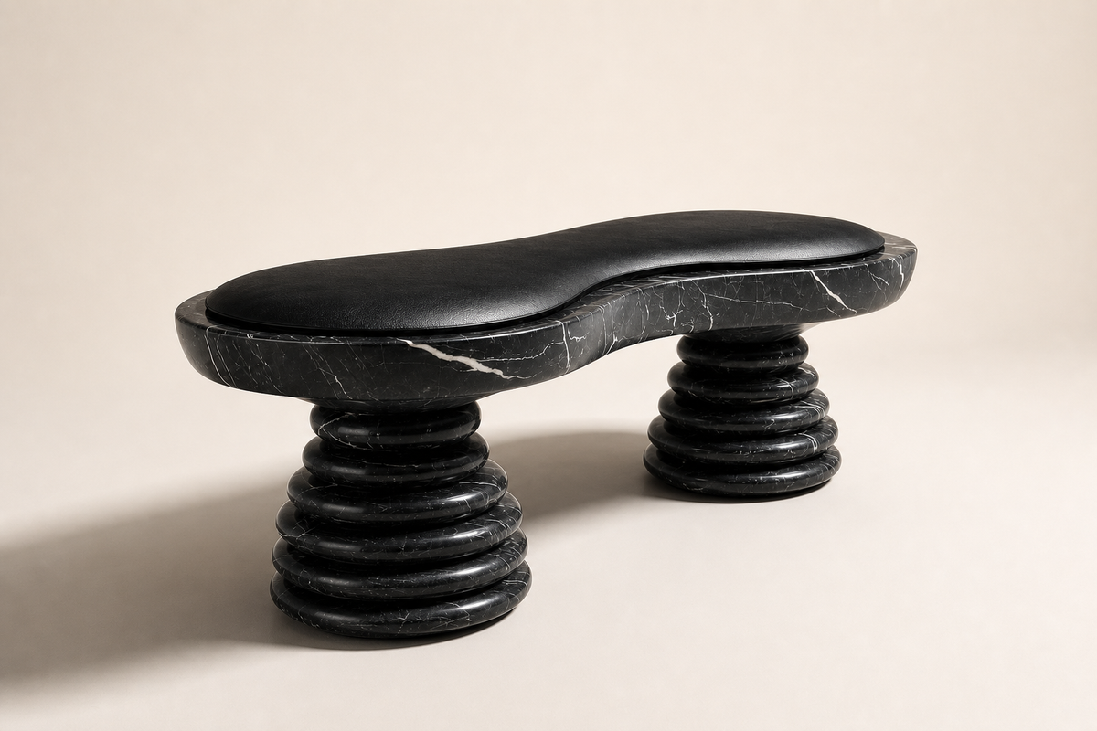 Placida stone sculptural bench, three-quarter studio view showing its profile