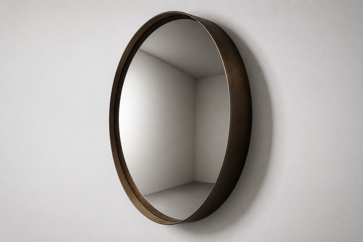Pupila — Ø 200 cm convex mirror in a dark patinated bronze ring, studio side angle showing its depth