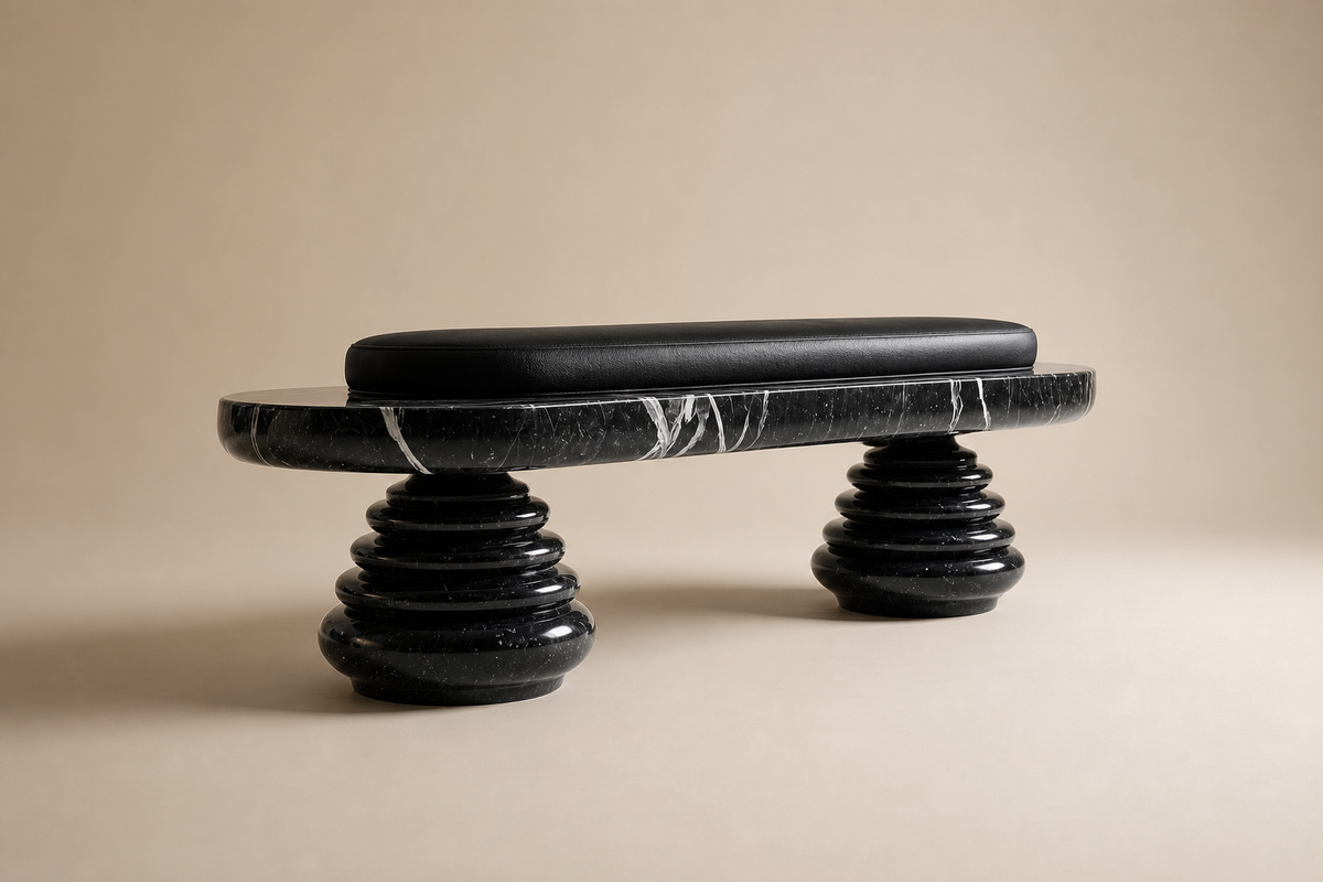 Quies stone sculptural bench, three-quarter studio view showing its profile