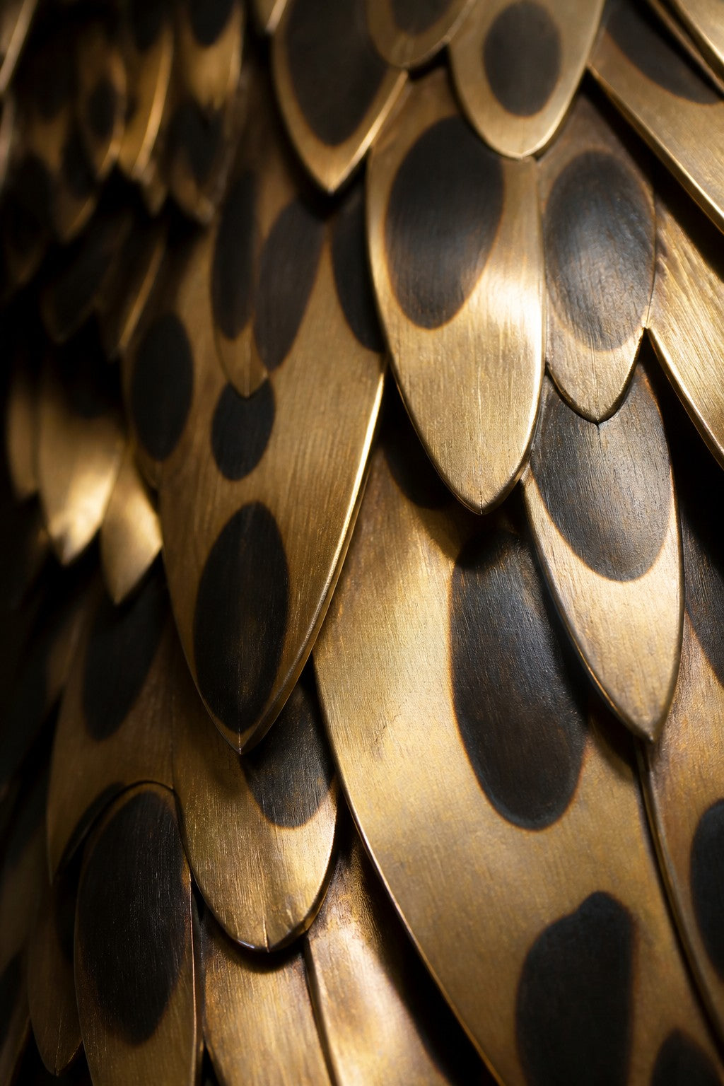 Rasad 150 — 150 cm brass wall sculpture of a seated leopard, close studio detail of the surface and material