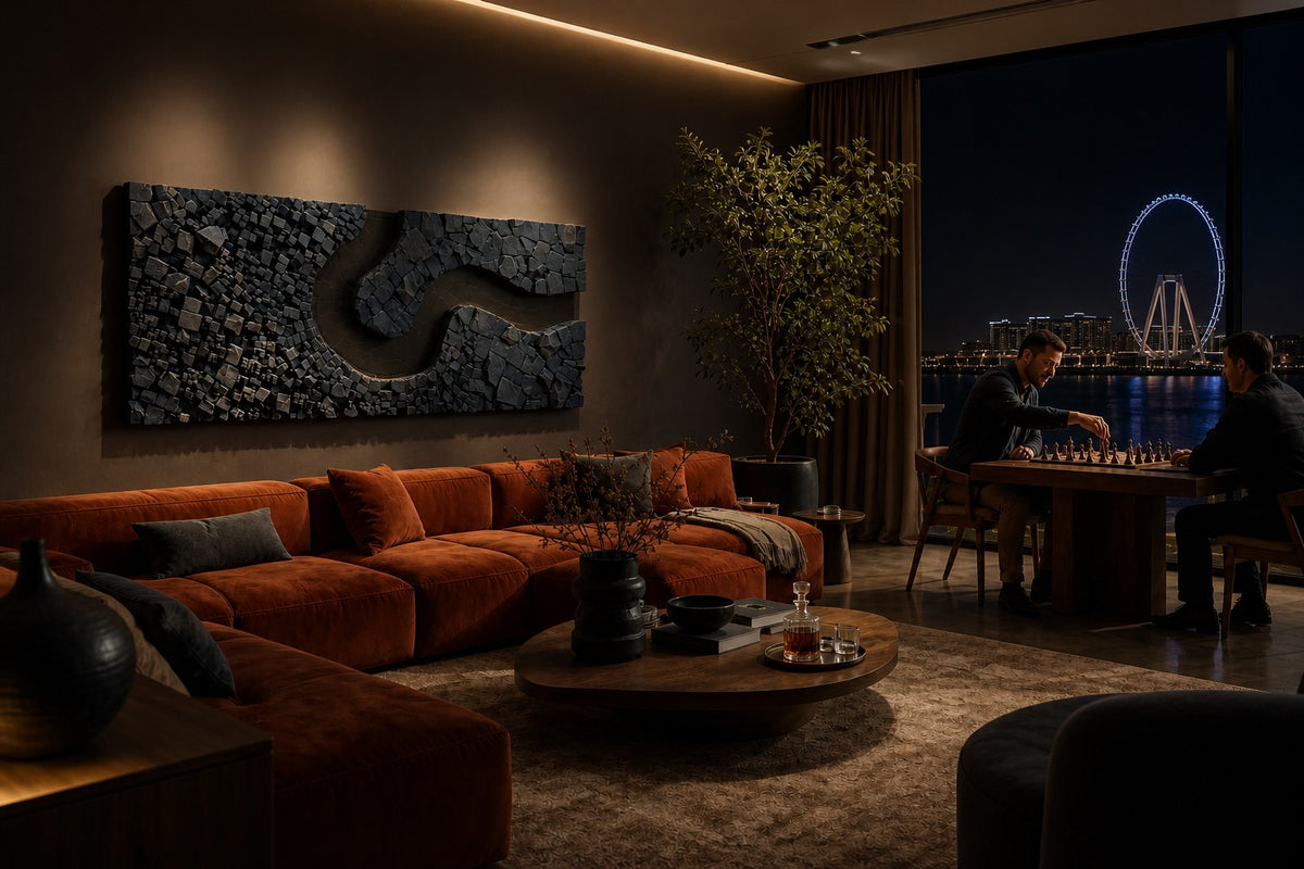 Recodo — slate stone block wall relief with a bronze river bend, the same room at night, lamps on