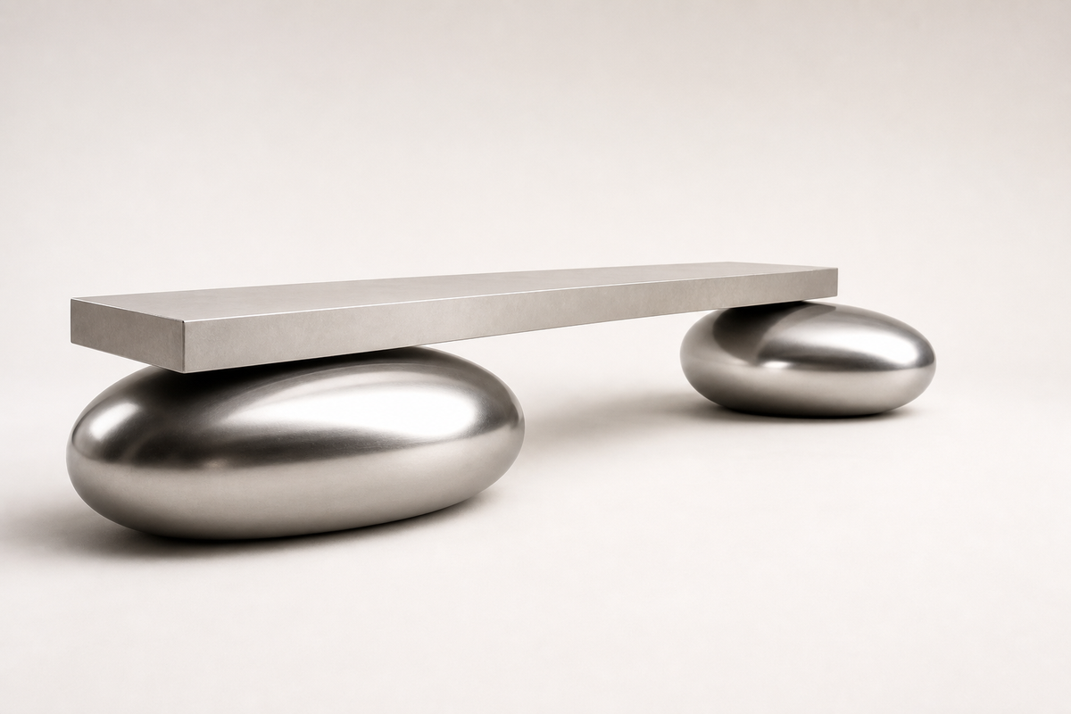 Repose stainless steel sculptural bench, three-quarter studio view showing its profile