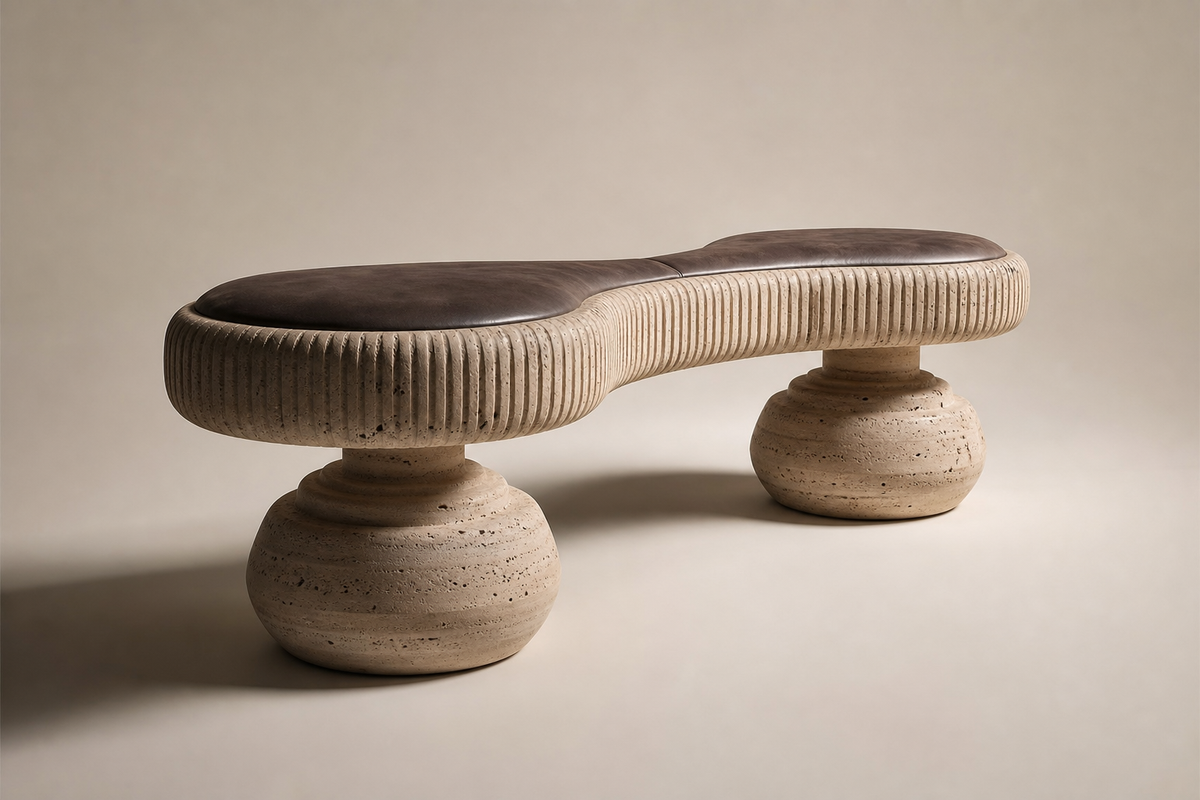 Riposo travertine sculptural bench, three-quarter studio view showing its profile