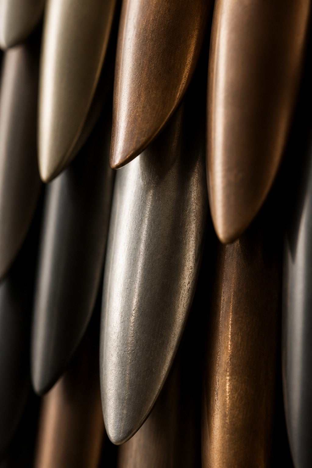 Sadafi — 80 × 150 cm tall oval wall mosaic of gold, black and silver plates, close studio detail of the surface and material