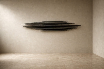 Graphite steel wall sculpture Saeta, a single tapered blade laid across a concealed rail, on a plaster wall.