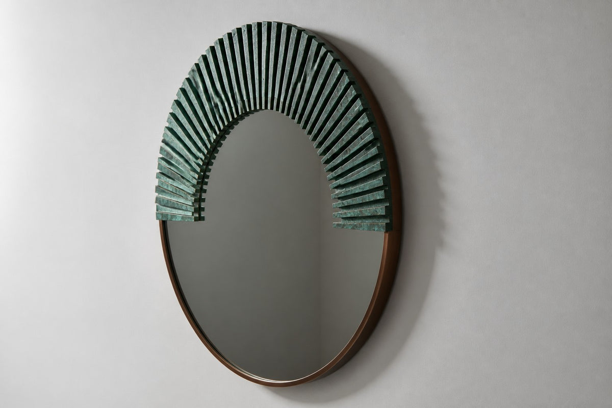 Sana — Ø 140 cm round wall mirror with a verdigris bronze sunburst, studio side angle showing its depth