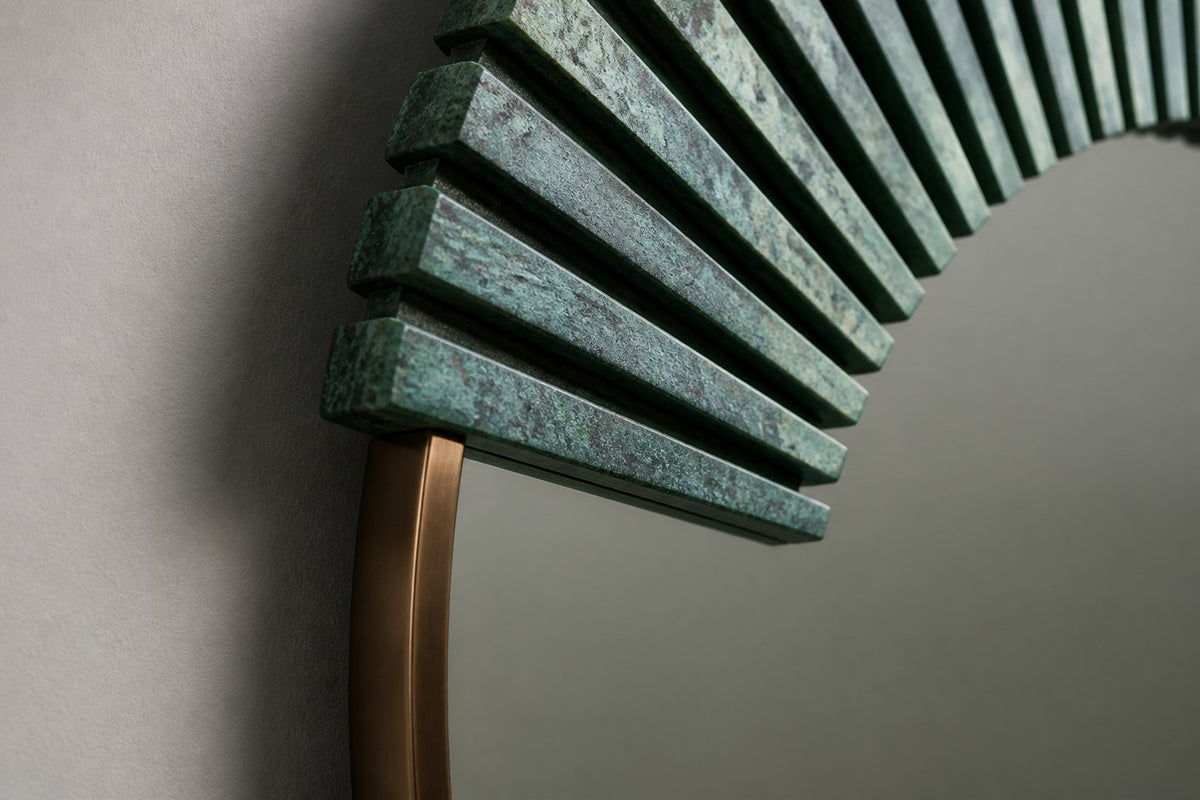 Sana — Ø 140 cm round wall mirror with a verdigris bronze sunburst, close detail of the surface and edge