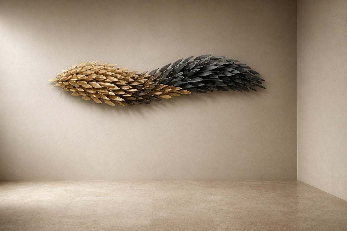 Sanabil — 200 × 55 cm long wall sculpture of layered gold and black scales flowing like a wing, three-quarter studio view showing its profile