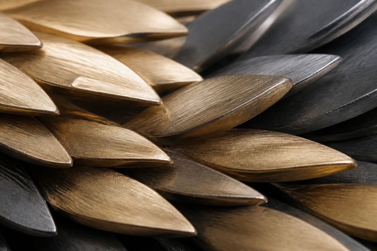 Sanabil — 200 × 55 cm long wall sculpture of layered gold and black scales flowing like a wing, close studio detail of the surface and material
