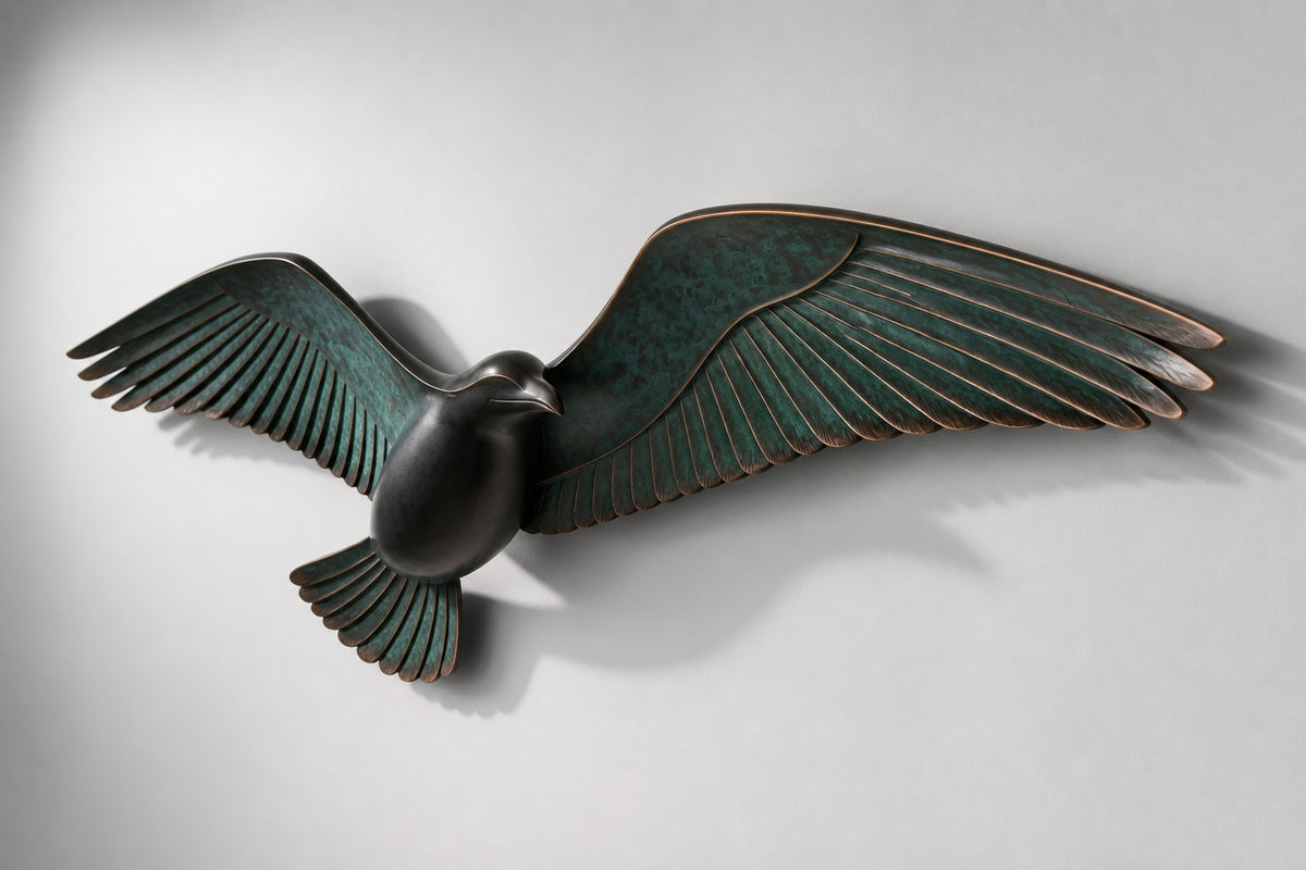 Saqr — verdigris bronze falcon in flight wall sculpture, studio side angle showing its depth