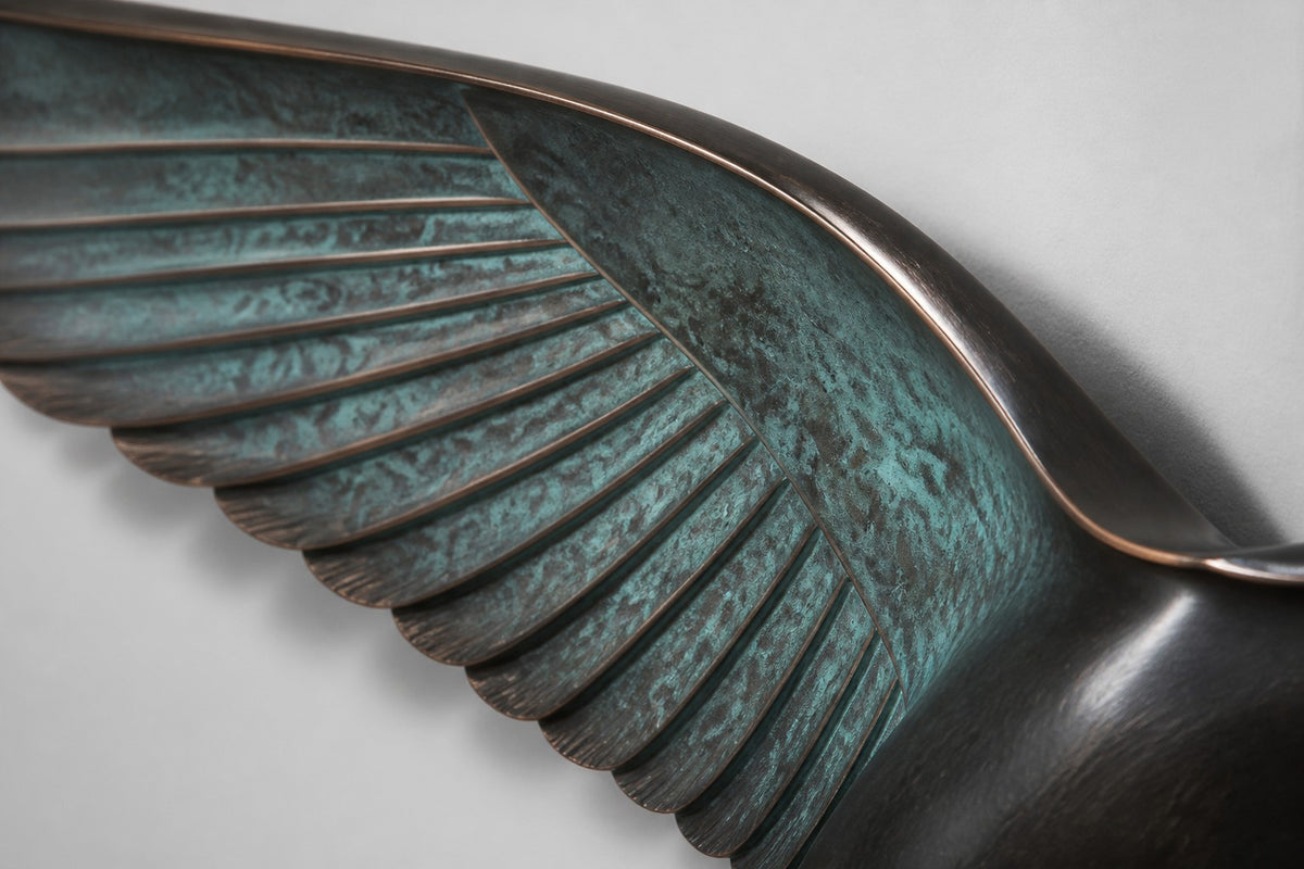 Saqr — verdigris bronze falcon in flight wall sculpture, close detail of the surface and edge