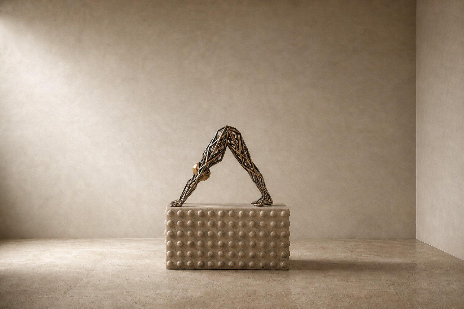 Bronze strut-cage sculpture Sbalzo forming an inverted arch, gilt and blackened, on a beaded travertine block.