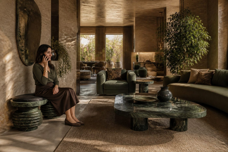Sedara stone sculptural bench, shown in a room setting, at full scale