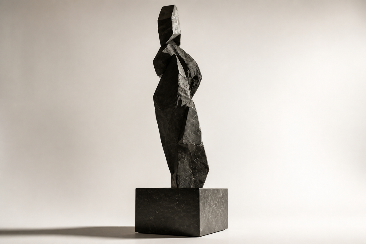 SENTINEL stone sculpture, three-quarter studio view showing its profile