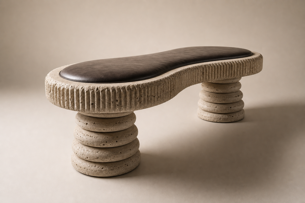 Sereda travertine sculptural bench, three-quarter studio view showing its profile