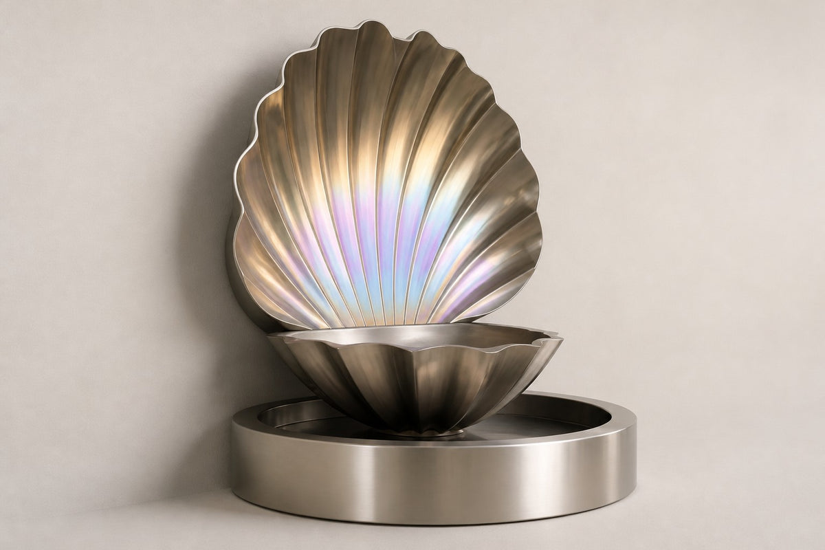 Serein — iridescent scallop wall fountain, studio side angle showing its depth