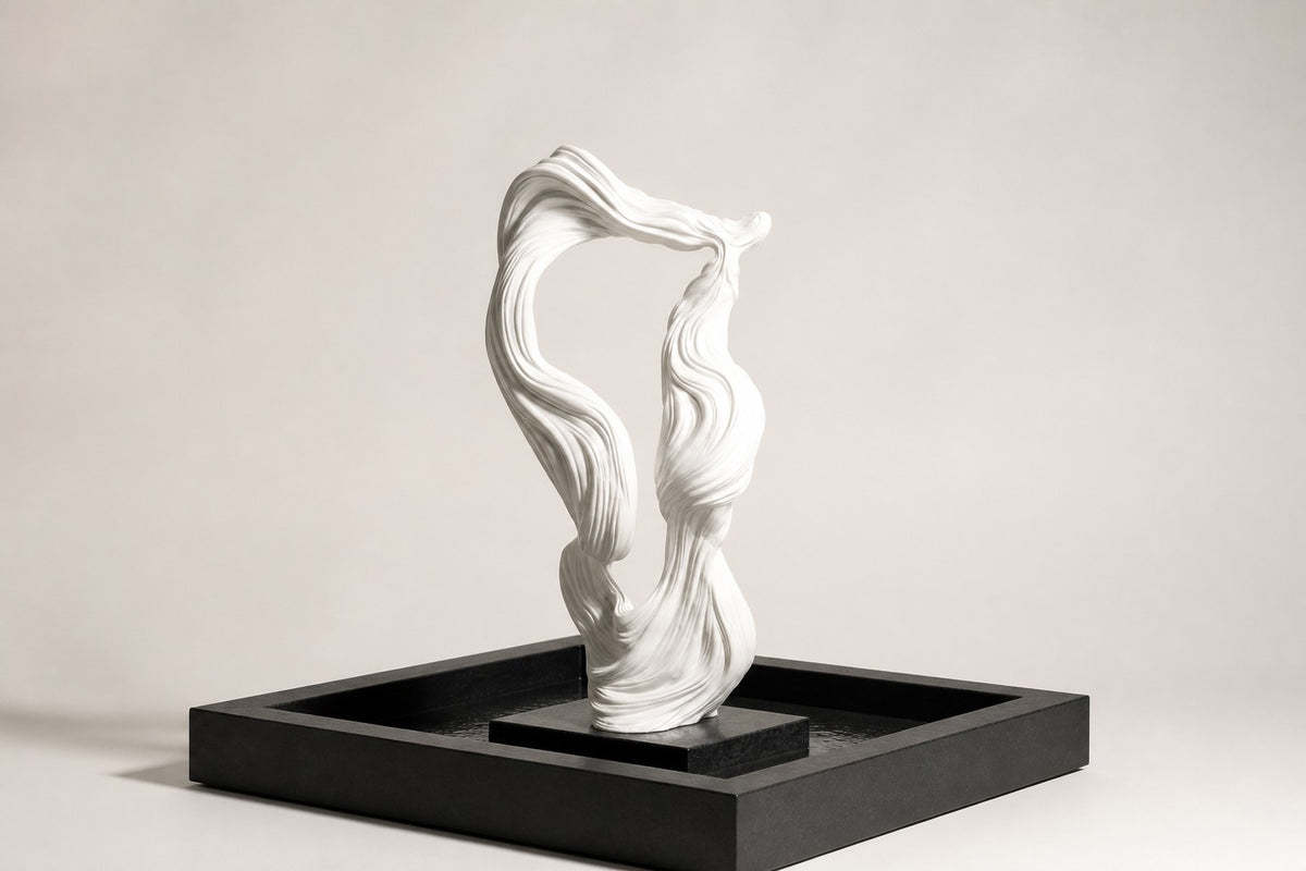 Shiranami — white ribbon fountain in a black square basin, studio side angle showing its depth