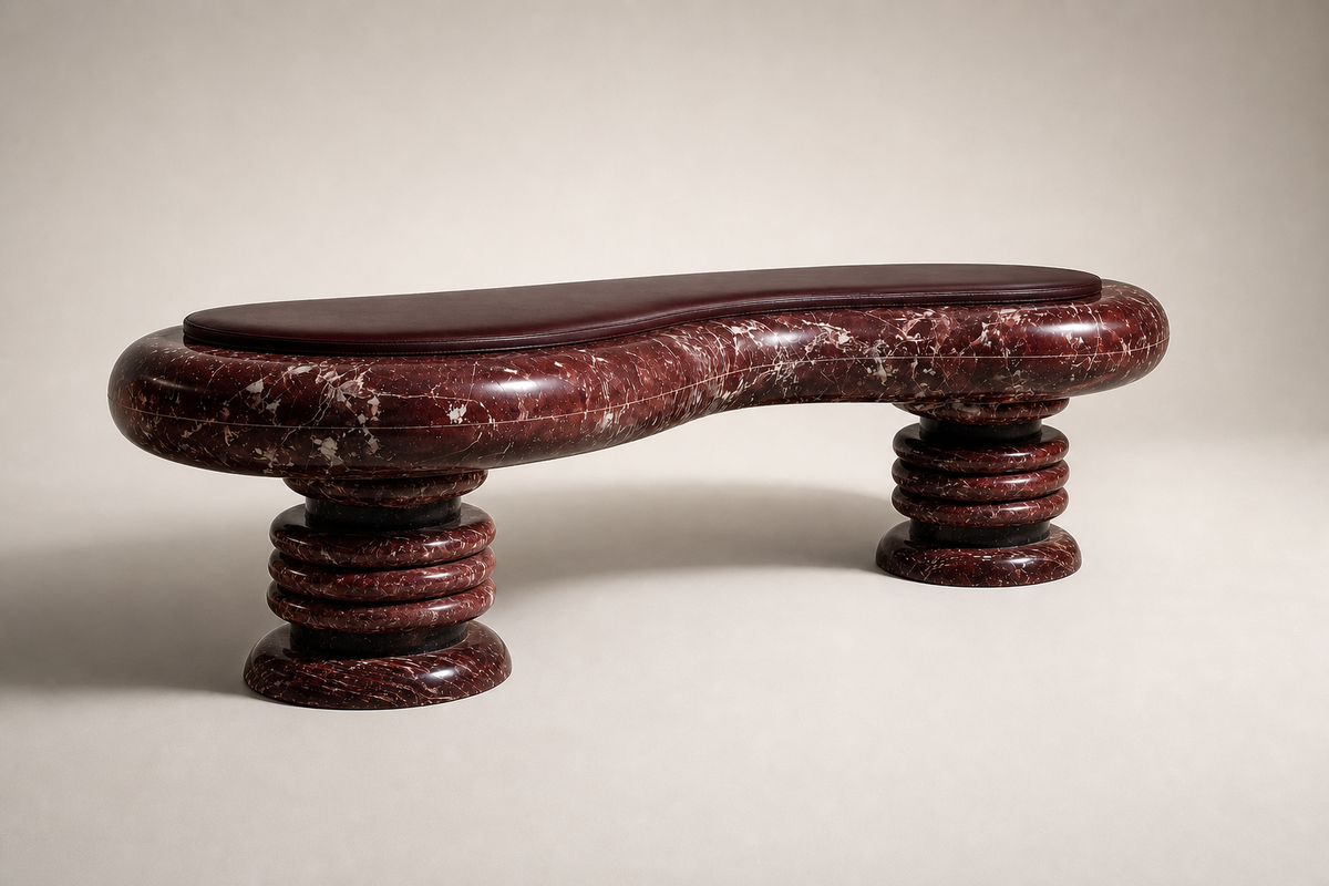 Siesta stone sculptural bench, three-quarter studio view showing its profile