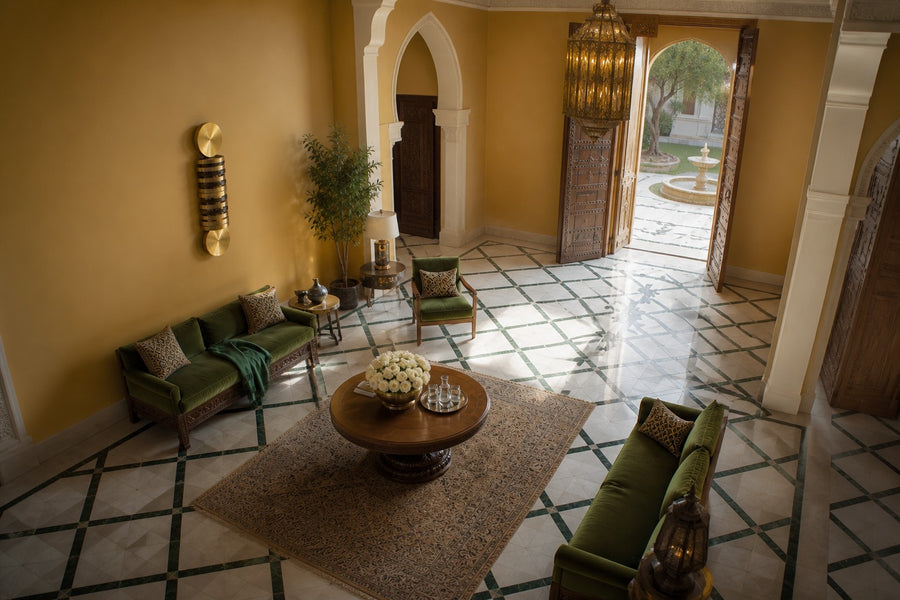 Solana — vertical brass and bronze disc column wall sculpture, seen from above in the room