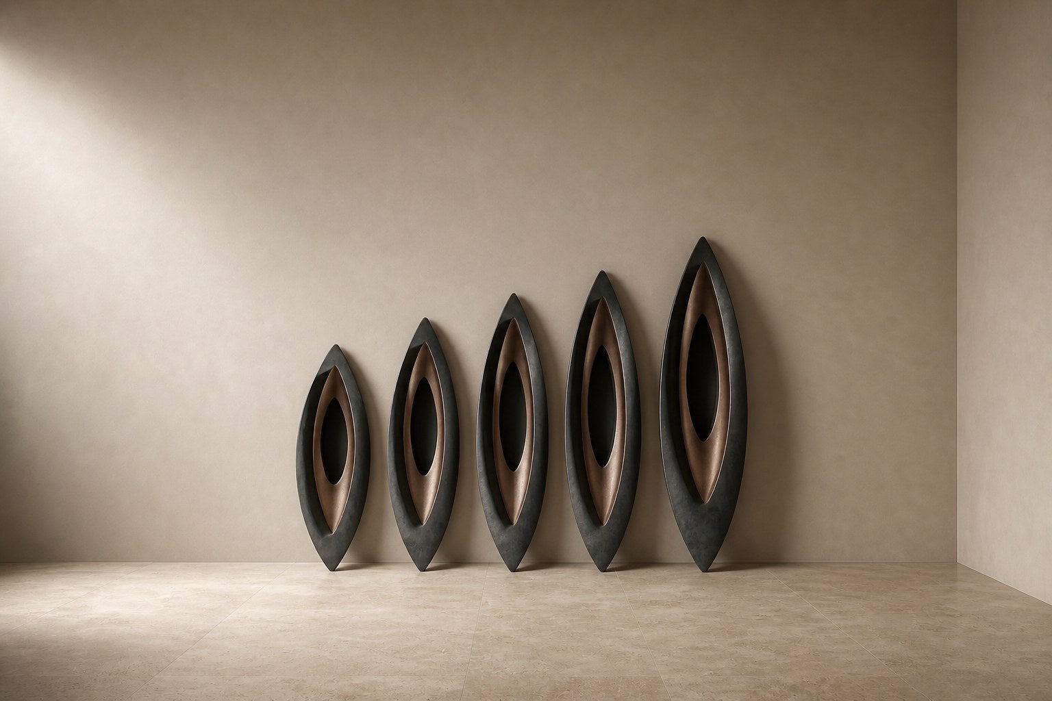 Five graduated lens-shaped bronze forms in ascending order, leaning against a plaster wall.