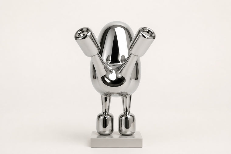 Tayr — 50 cm mirror-polished chrome balloon-form bird sculpture on a white base, studio view of the whole piece