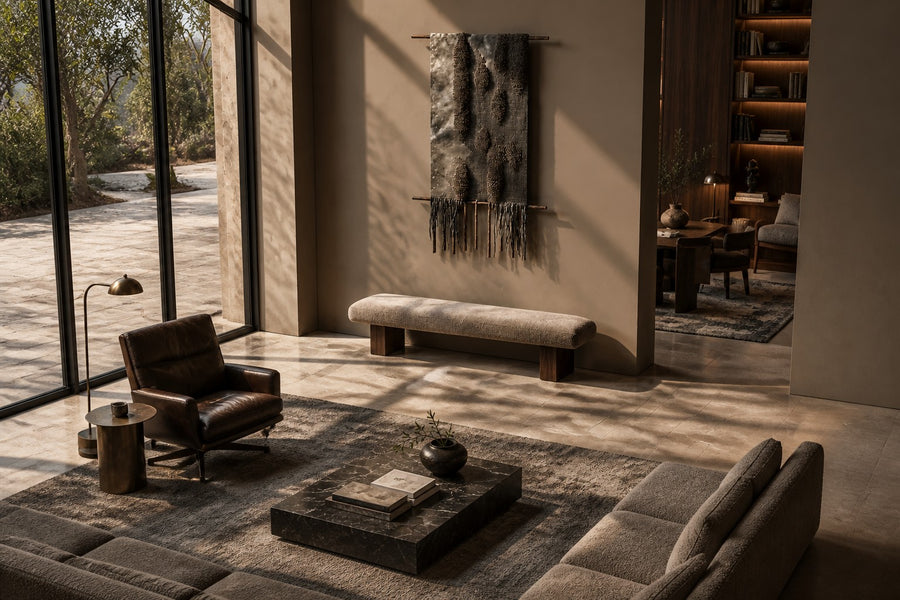 Telar — dark bronze wall hanging cast from a tribal textile, seen from above in the room
