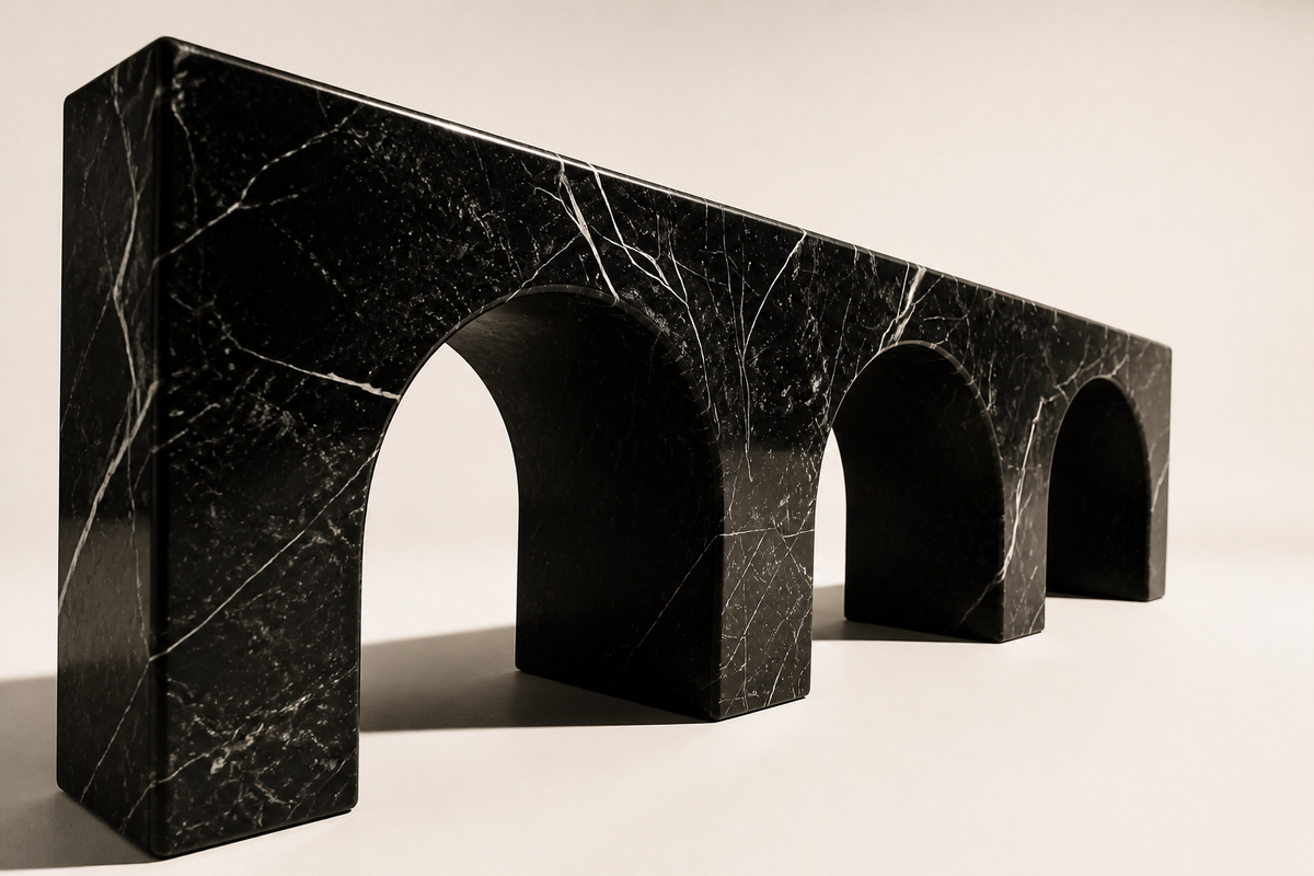 Tri-Arch Monolith Marble Bench, three-quarter studio view showing its profile