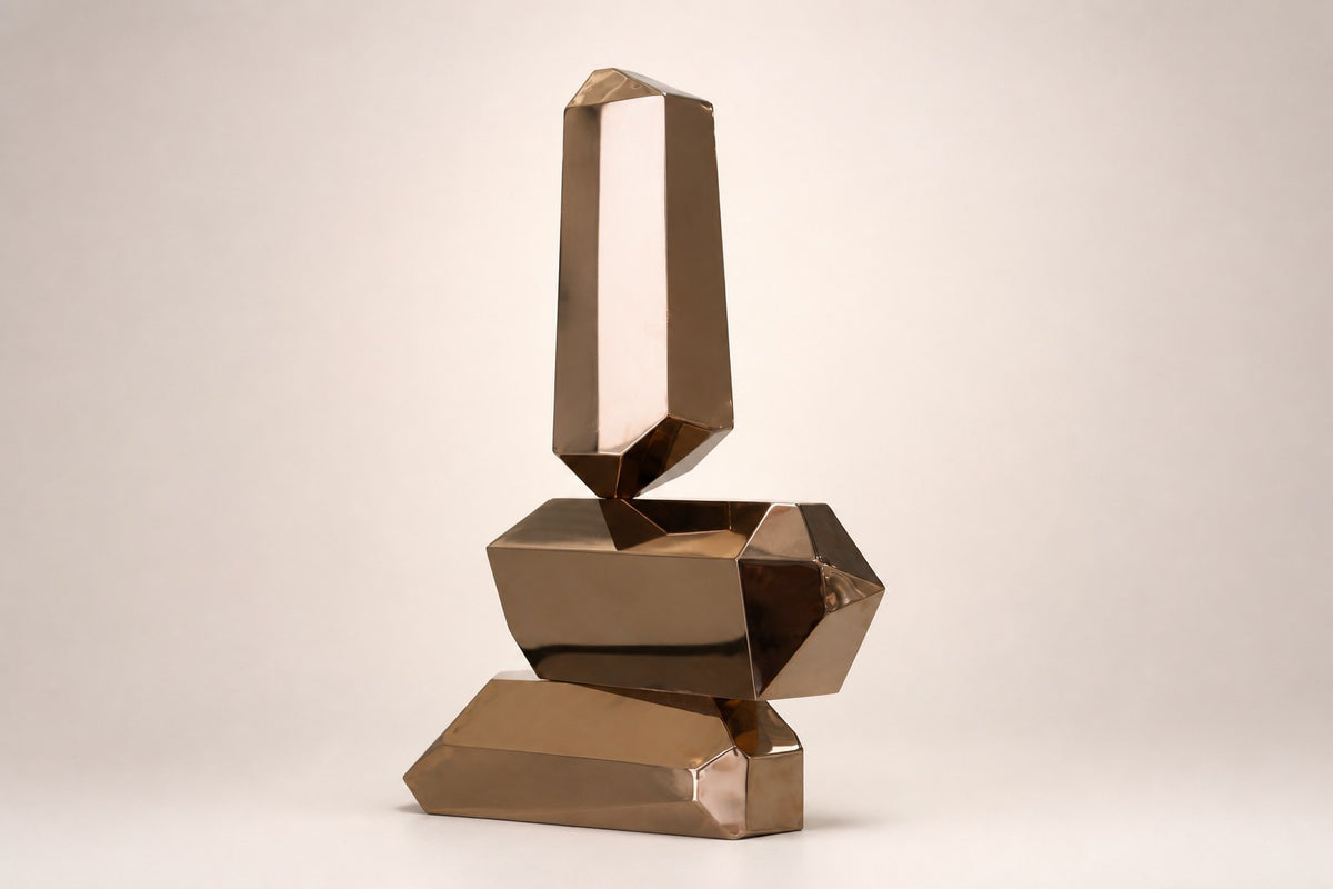 Trongsa — polished bronze faceted stacked sculpture, studio front view