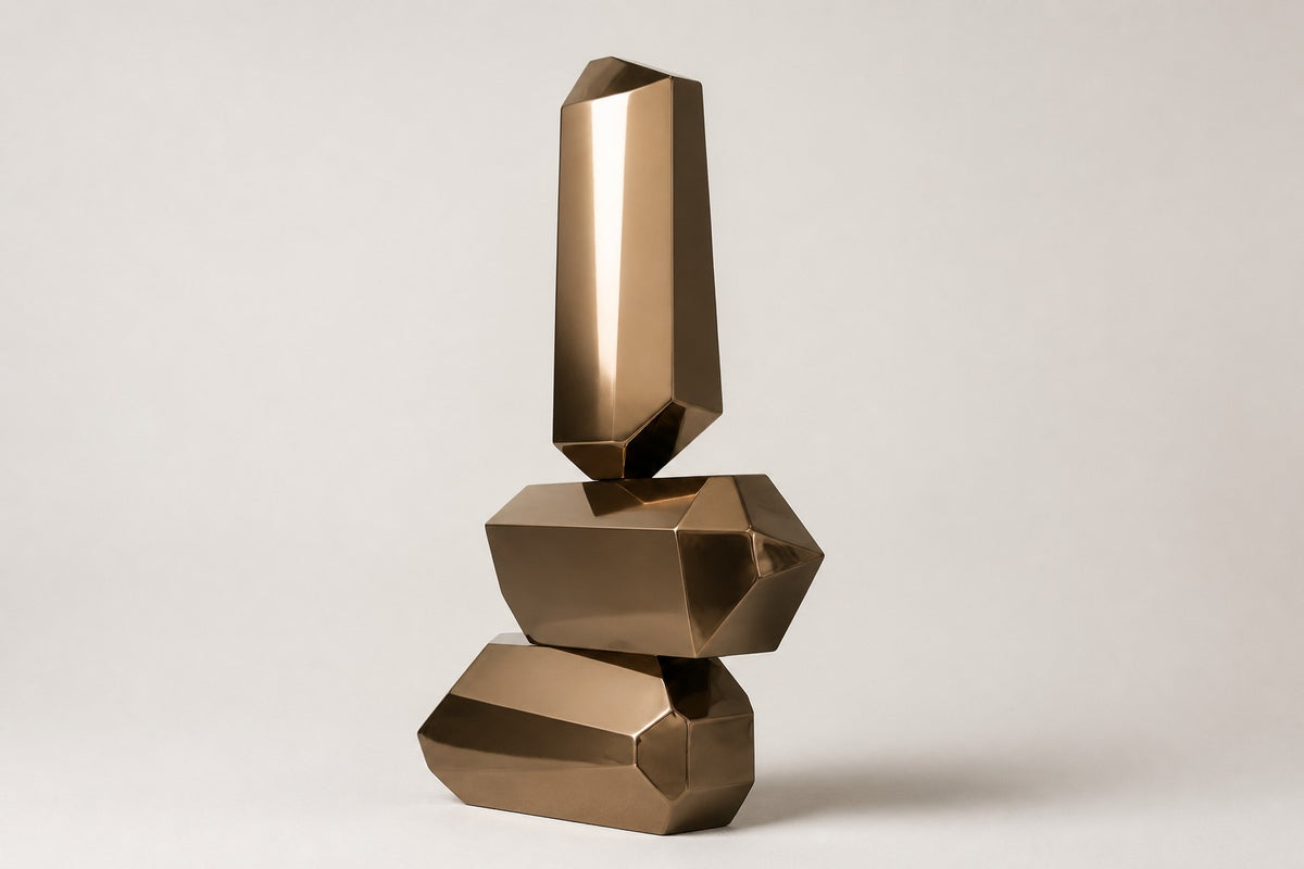Trongsa — polished bronze faceted stacked sculpture, studio side angle showing its depth