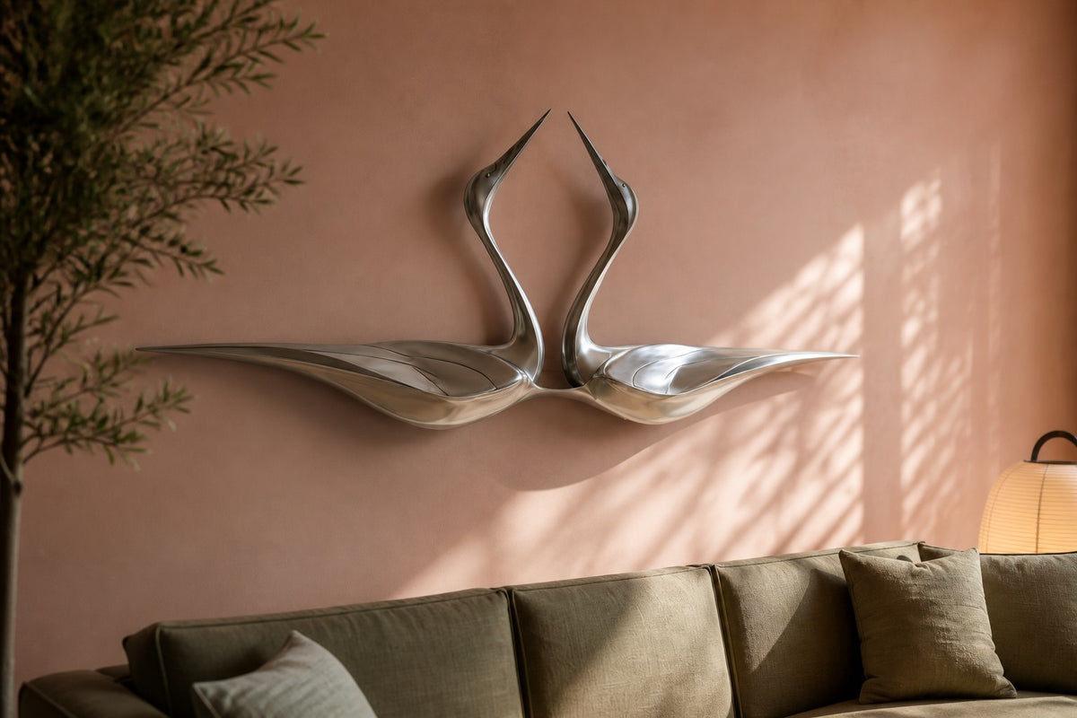 Tsuru — satin stainless steel pair of cranes wall sculpture, close view on the wall