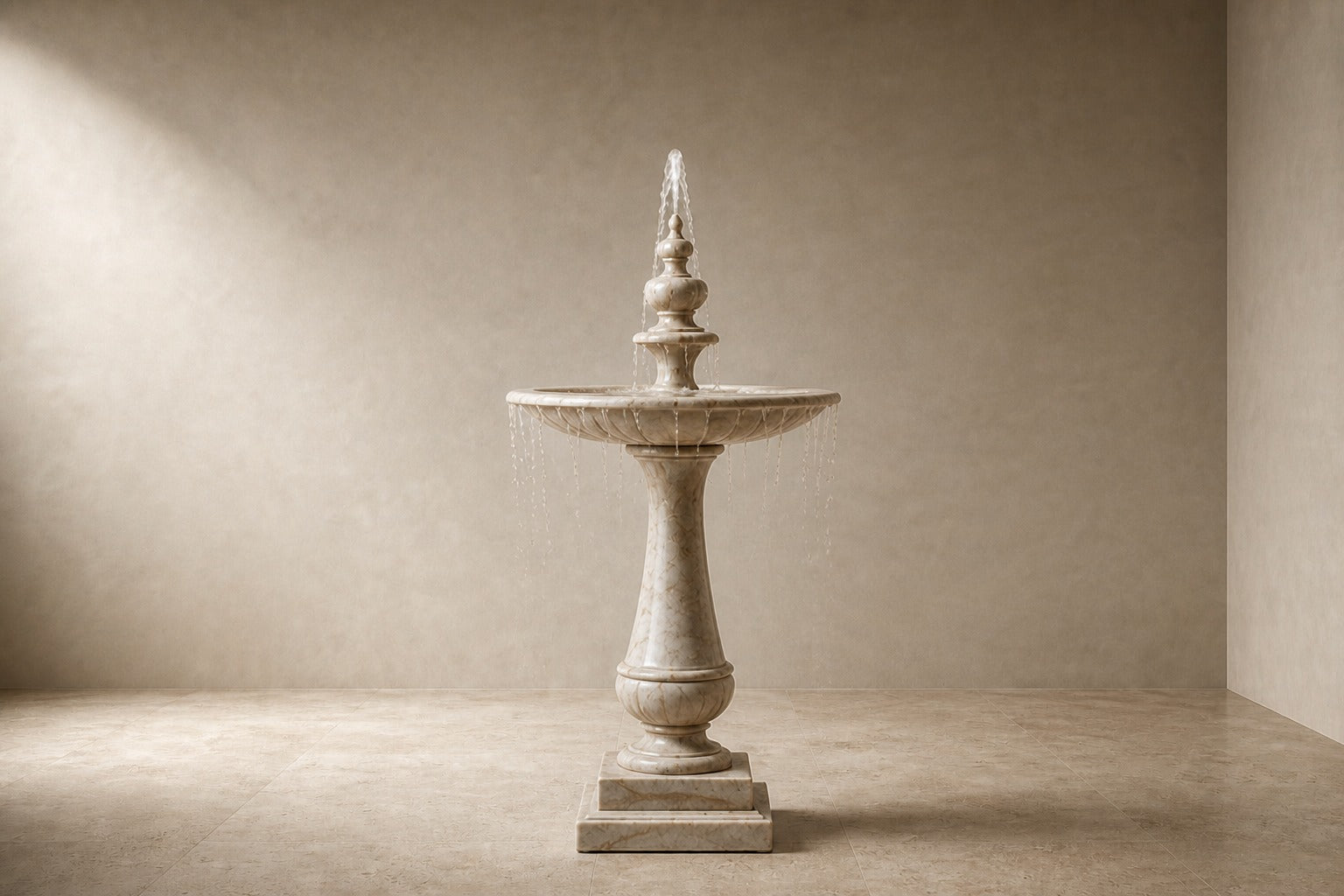 Pale limestone pedestal fountain Vasca Ø65, cream and white with amber veining, on a pale stone floor.