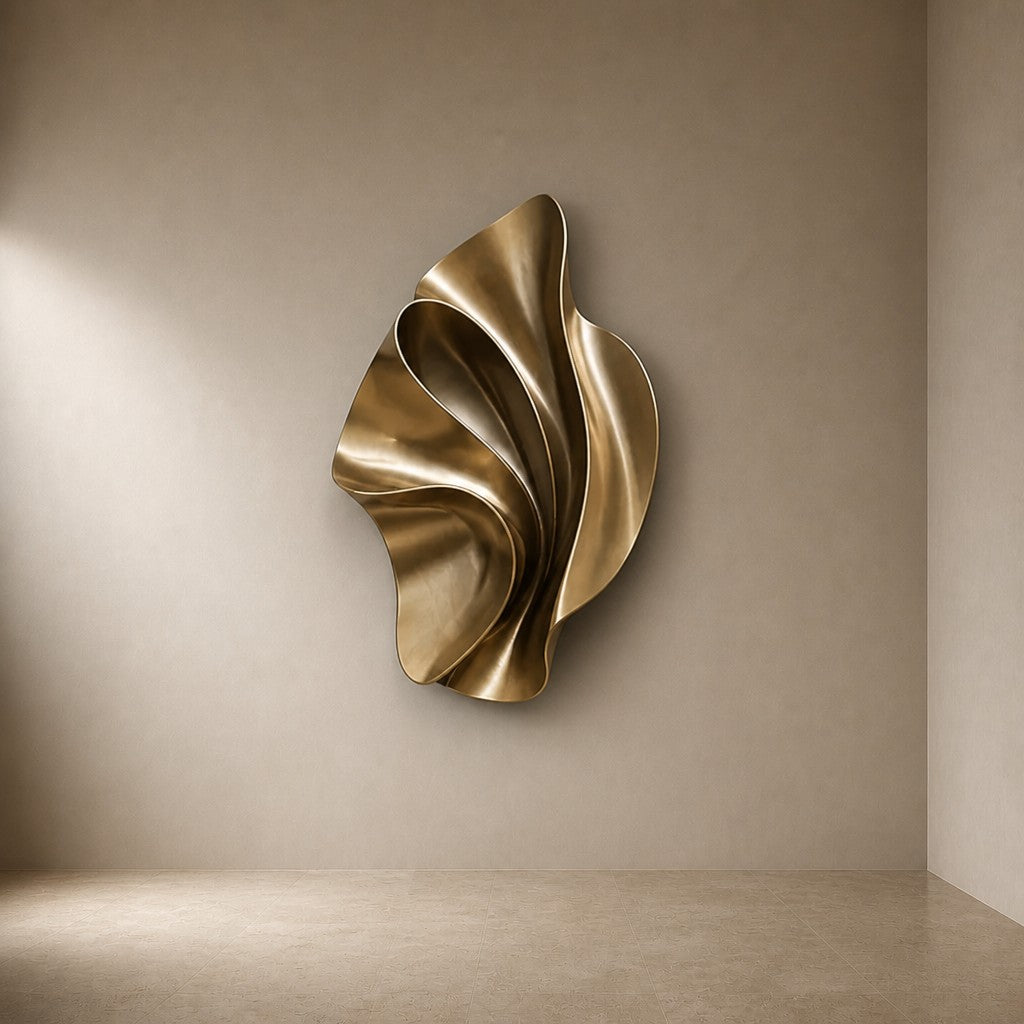 Ventaglio — 100 × 120 cm champagne brass wall sculpture of a folded fan, three-quarter studio view showing its profile