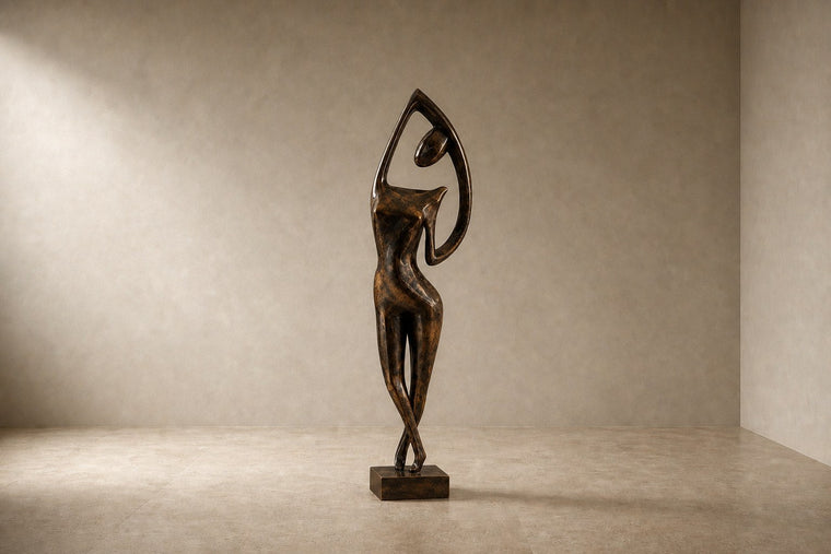 Patinated bronze figure sculpture Voluta, one arm arced overhead into a closed loop, on a small bronze block base.