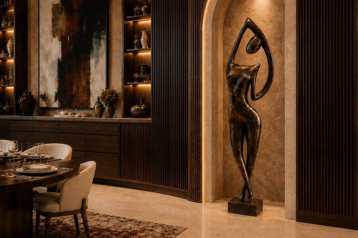 Patinated bronze figure sculpture Voluta, one arm arced overhead into a closed loop, on a small bronze block base.